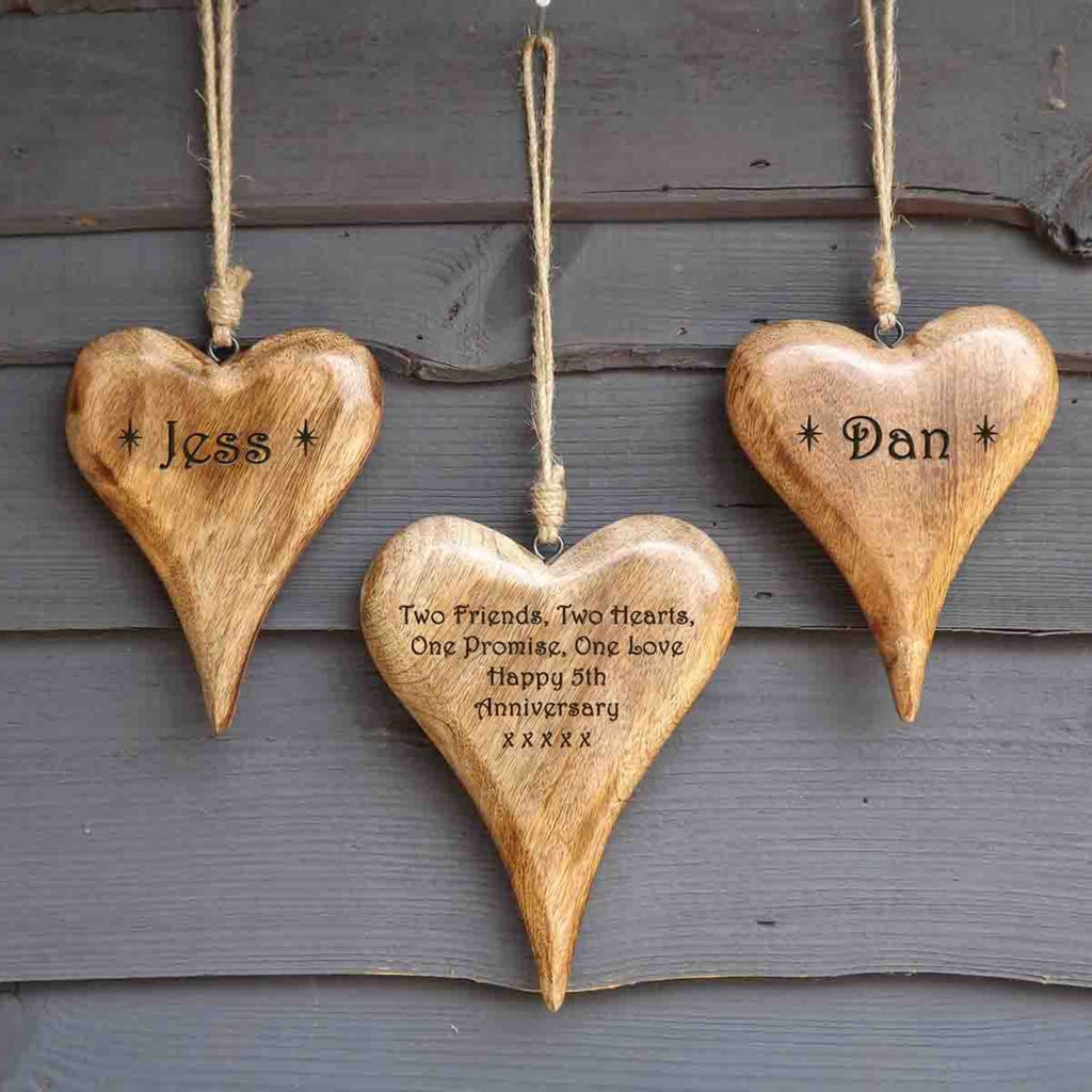 Personalised set of wooden hanging hearts in solid wood - A unique 5th Anniversary Gift