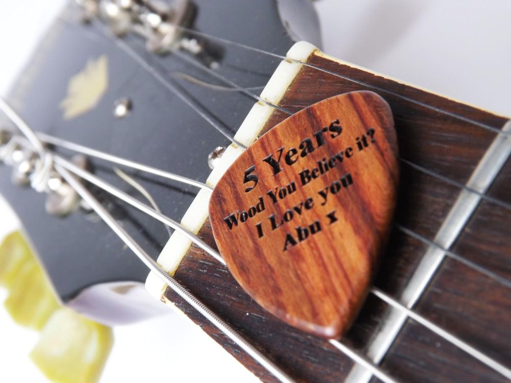 5th Anniversary Wooden Guitar Pick Engraved with your name or message.